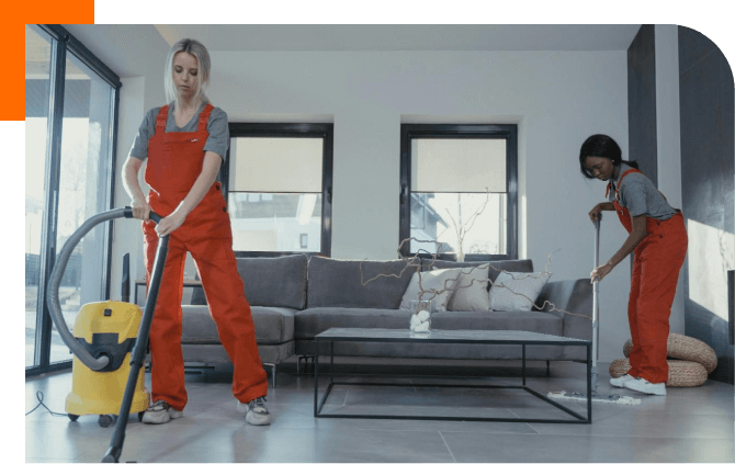 two women cleaning a house