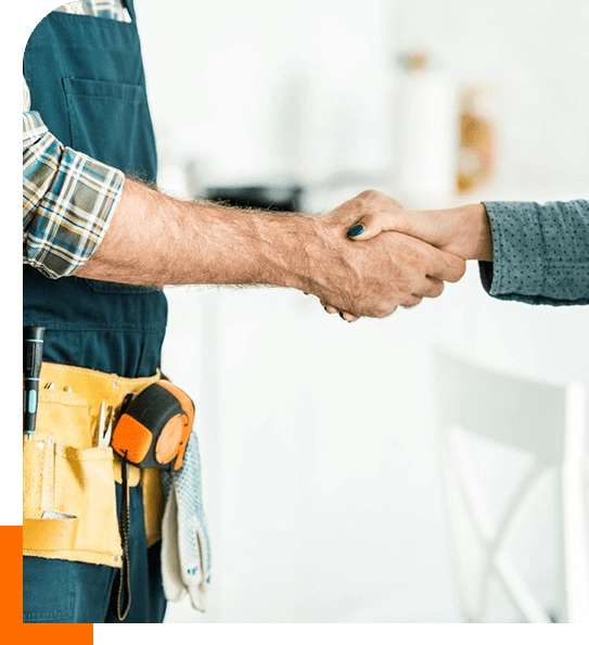 Two men shaking hands in a room.