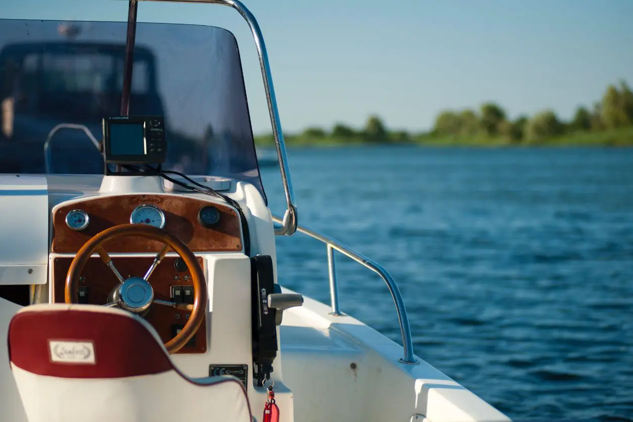 A boat with the steering wheel turned on.